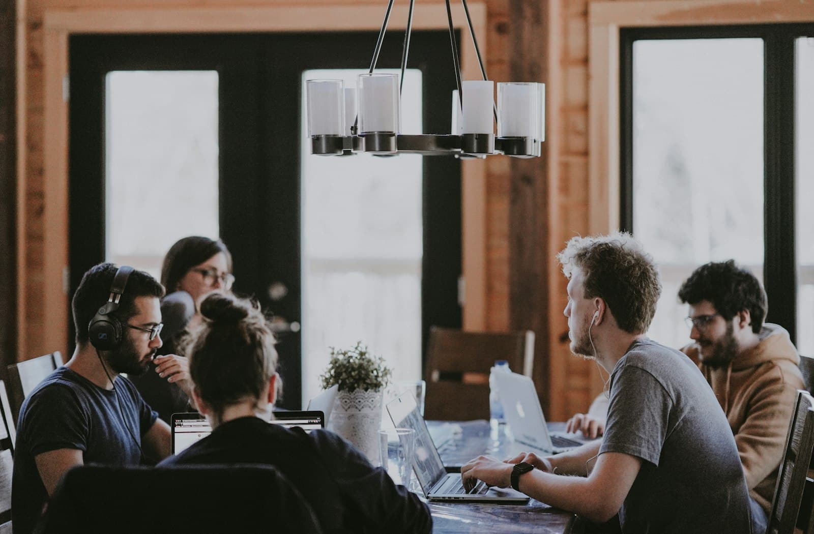 A team working through a build together at one table
